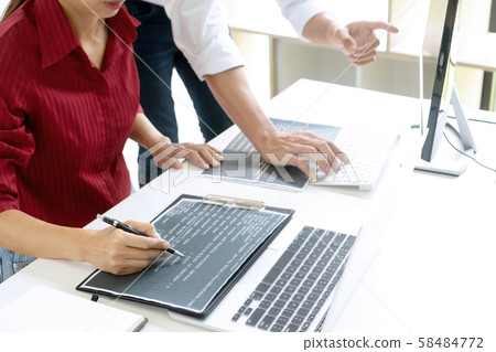 Teamwork team programmer working with computer 58484772