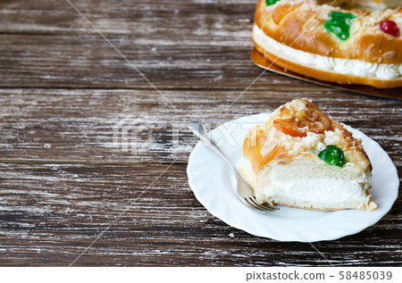 Spanish Christmas cake with fruits, nut and icing Spanish Christmas cake with fruits, nut and icing 58485039