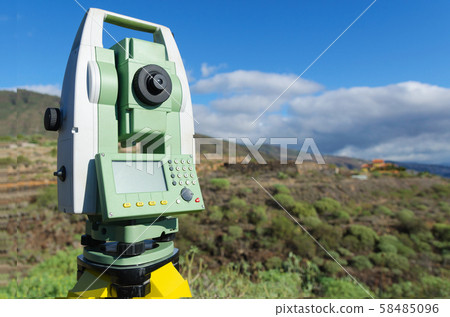 Total station outdoor at construction site. Copy space. Total station outdoor at construction site. Copy space. 58485096