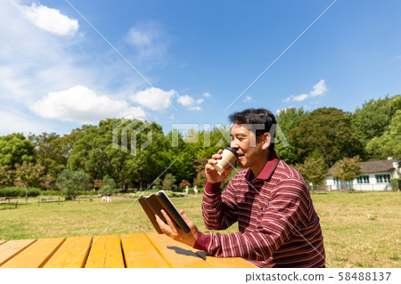 Telework break in a sunny park Telework break in a sunny park 58488137