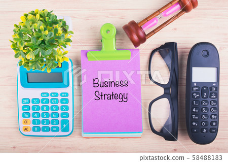 notepad with BUSINESS STRATEGY word on wooden desk notepad with BUSINESS STRATEGY word on wooden desk 58488183