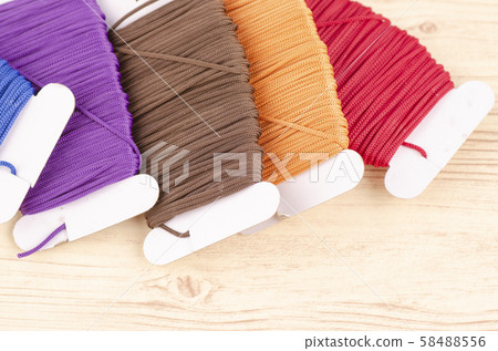 colorful stacking cotton yarn wool on desk 58488556