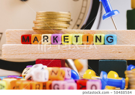 cube with word MARKETING on wooden desk cube with word MARKETING on wooden desk 58488584