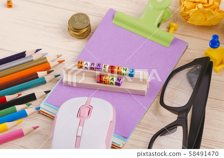 cube with word MARKETING PLAN on wooden desk cube with word MARKETING PLAN on wooden desk 58491470