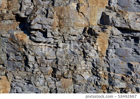 Rocks carved by sea water erosion. Stones texture and background. Rock texture 58492667