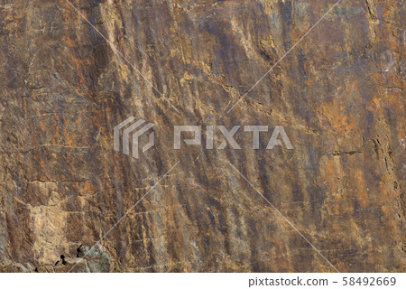 Rocks carved by sea water erosion. Stones texture and background. Rock texture 58492669