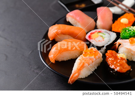 close up of sashimi sushi set on black dish, 58494541