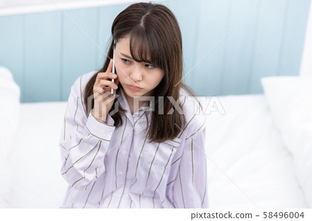 Young woman mobile phone Young woman mobile phone 58496004