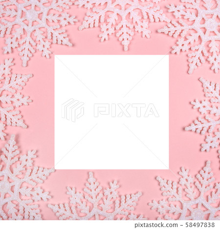Winter pattern made of snowflakes and on pink background. 58497838