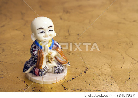 stone statue sharp wooden background  58497937