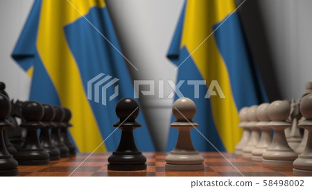 Flags of Sweden behind pawns on the chessboard. Chess game or political rivalry related 3D rendering 58498002