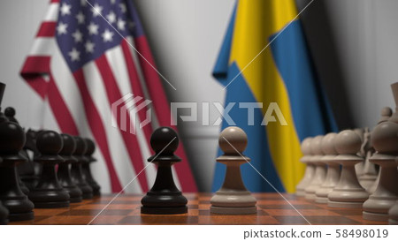 Flags of USA and Sweden behind pawns on the chessboard. Chess game or political rivalry related 3D 58498019