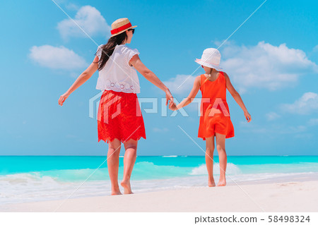 Portrait of little girl and mother on summer vacation Portrait of little girl and mother on summer vacation 58498324
