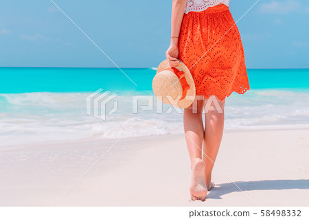 Close up of female feet on white sand beach Close up of female feet on white sand beach 58498332