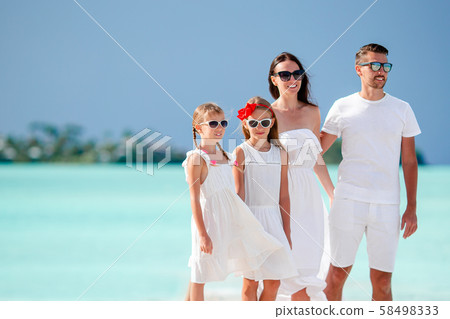 Happy family with kids on the beach together 58498333
