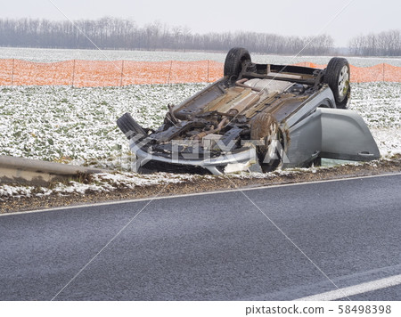 Overturned Car Beside the Road Overturned Car Beside the Road 58498398