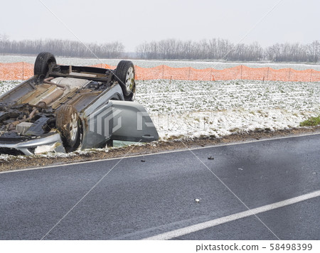 Overturned Car Beside the Road 58498399