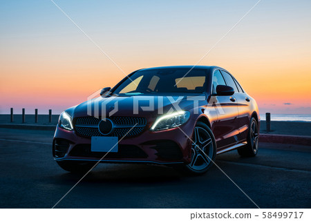 Wine red car and coast of dawn 58499717
