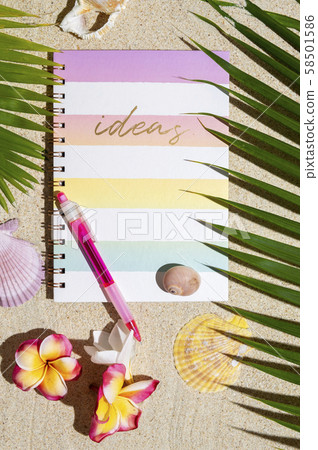 Top view of Traveller notebook with pen on sand Top view of Traveller notebook with pen on sand 58501586