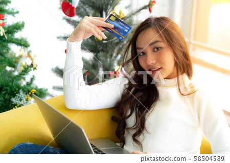 Young adult shopping Christmas Holiday Young adult shopping Christmas Holiday 58504589