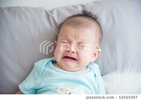 Closeup shot of little asian infant crying Closeup shot of little asian infant crying 58505007