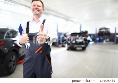 Laughing joyful male mechanic 58506815