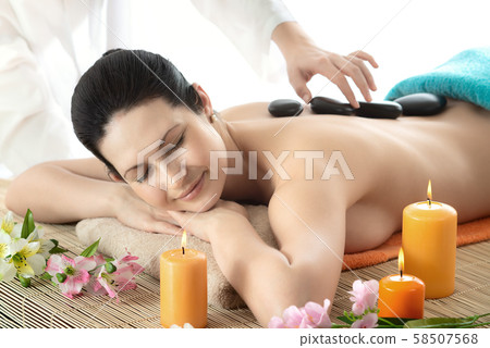 young woman on spa treatment young woman on spa treatment 58507568
