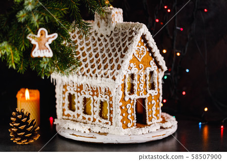 Gingerbread house on a dark background 58507900