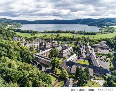 Aerial view on Laacher See behind the famous abbey Maria Laach in Rhineland-Palatinate, Germany Aerial view on Laacher See behind the famous abbey Maria Laach in Rhineland-Palatinate, Germany 58508708