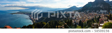 Breathtaking Panoramic view of Taormina, Etna from walls of the Greek Theater 58509156