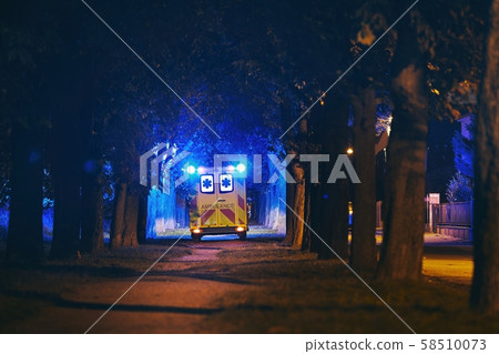 Emergency ambulance in dark alley 58510073