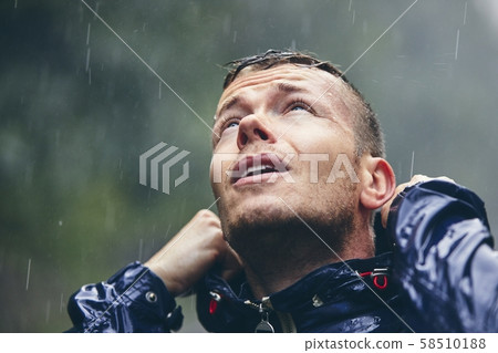 Traveler in heavy rain Traveler in heavy rain 58510188