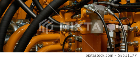 Banner with close up view of hydraulic pipes of 58511177