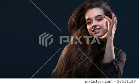 Close-up portrait of charming young thinking woman 58511187