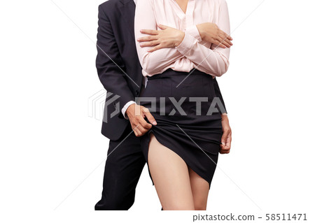 sexual assault and abuse against women at work concept. male manager molesting female employee by touch leg under skirt in workplace 58511471