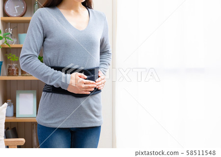 Woman wearing a corset 58511548