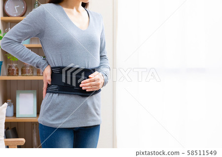 Woman wearing a corset 58511549