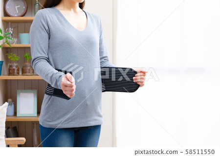 Woman wearing a corset 58511550