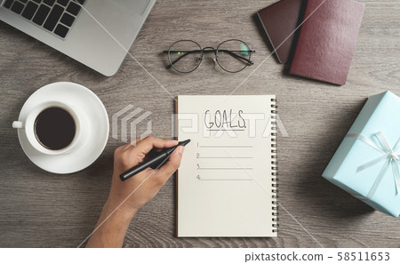 Top view of Man hand is planning and writing to do 58511653