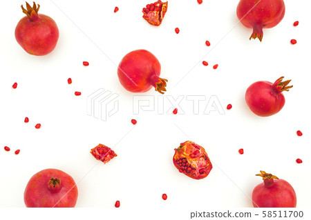 Pomegranate with seeds isolated on white background. Food background. Flat lay, top view Pomegranate with seeds isolated on white background. Food background. Flat lay, top view 58511700