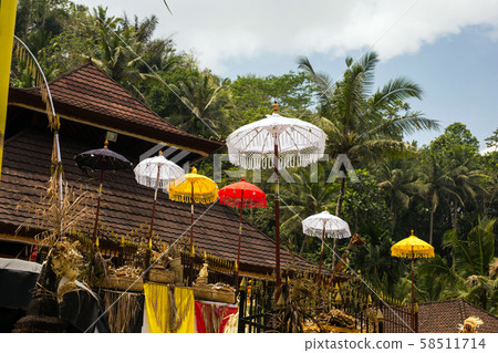 Group of beautiful Balinese flags and umbrellas at celebration ceremony in Hindu temple. Traditional Group of beautiful Balinese flags and umbrellas at celebration ceremony in Hindu temple. Traditional 58511714