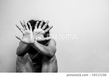 scared man lift hand up for say stop, to protect himself. anti human trafficking campaign. black and white color with copy space for campaign poster or flyer scared man lift hand up for say stop, to protect himself. anti human trafficking campaign. black and white color with copy space for campaign poster or flyer 58513198