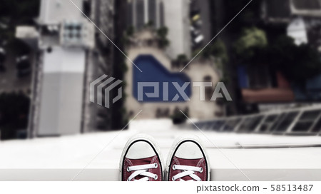 depression man stand on the edge of high building looking down at the ground and contemplating to commit suicide by jump buildings. commit suicide and major depressive disorder concept 58513487