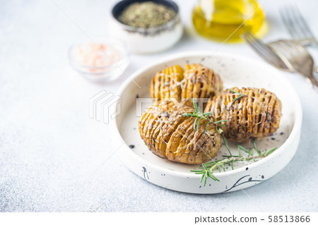 Baked hasselback potatoes 58513866