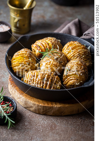 Baked hasselback potatoes 58513902