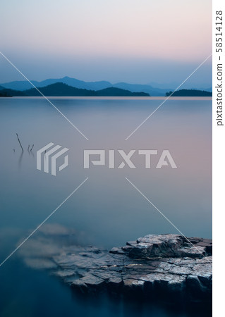 beautiful nature view of lake in the dusk at sunset time, blue tone beautiful nature view of lake in the dusk at sunset time, blue tone 58514128