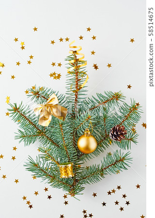 Christmas tree decorated with golden balls and Christmas tree decorated with golden balls and 58514675