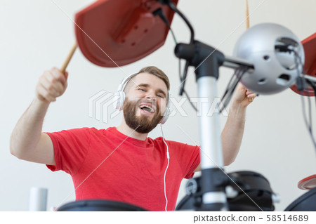 People, free time and hobby concept - Cool male drummer over white room background People, free time and hobby concept - Cool male drummer over white room background 58514689