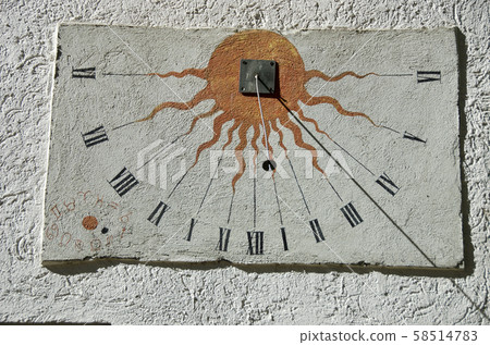Ancient sundial with signs of the zodiac on white  58514783
