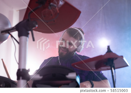 Hobbies, music and people concept - emotional man playing drums Hobbies, music and people concept - emotional man playing drums 58515003